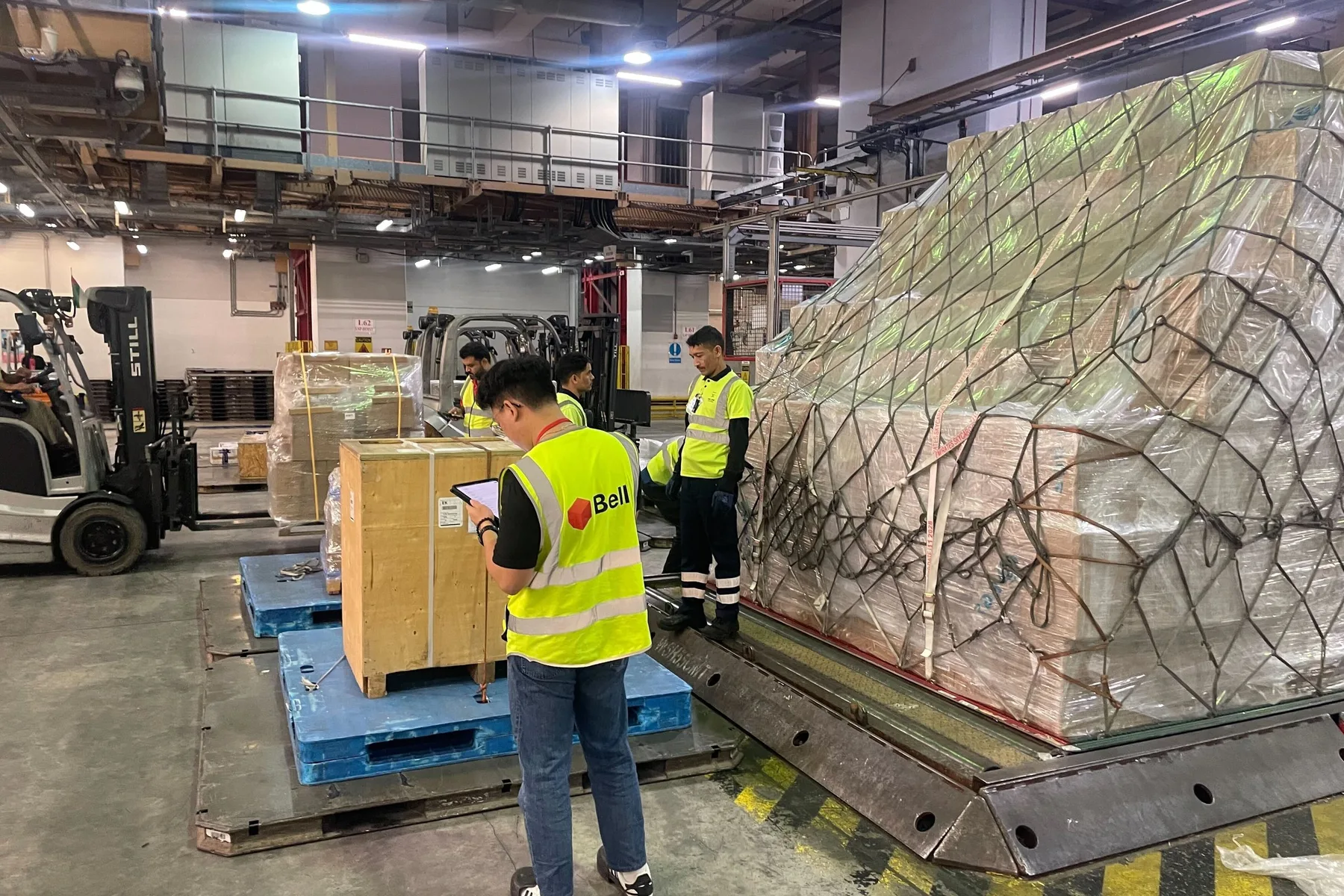 A Belli team member checking a netted ULD at the Emirates SkyCargo warehouse