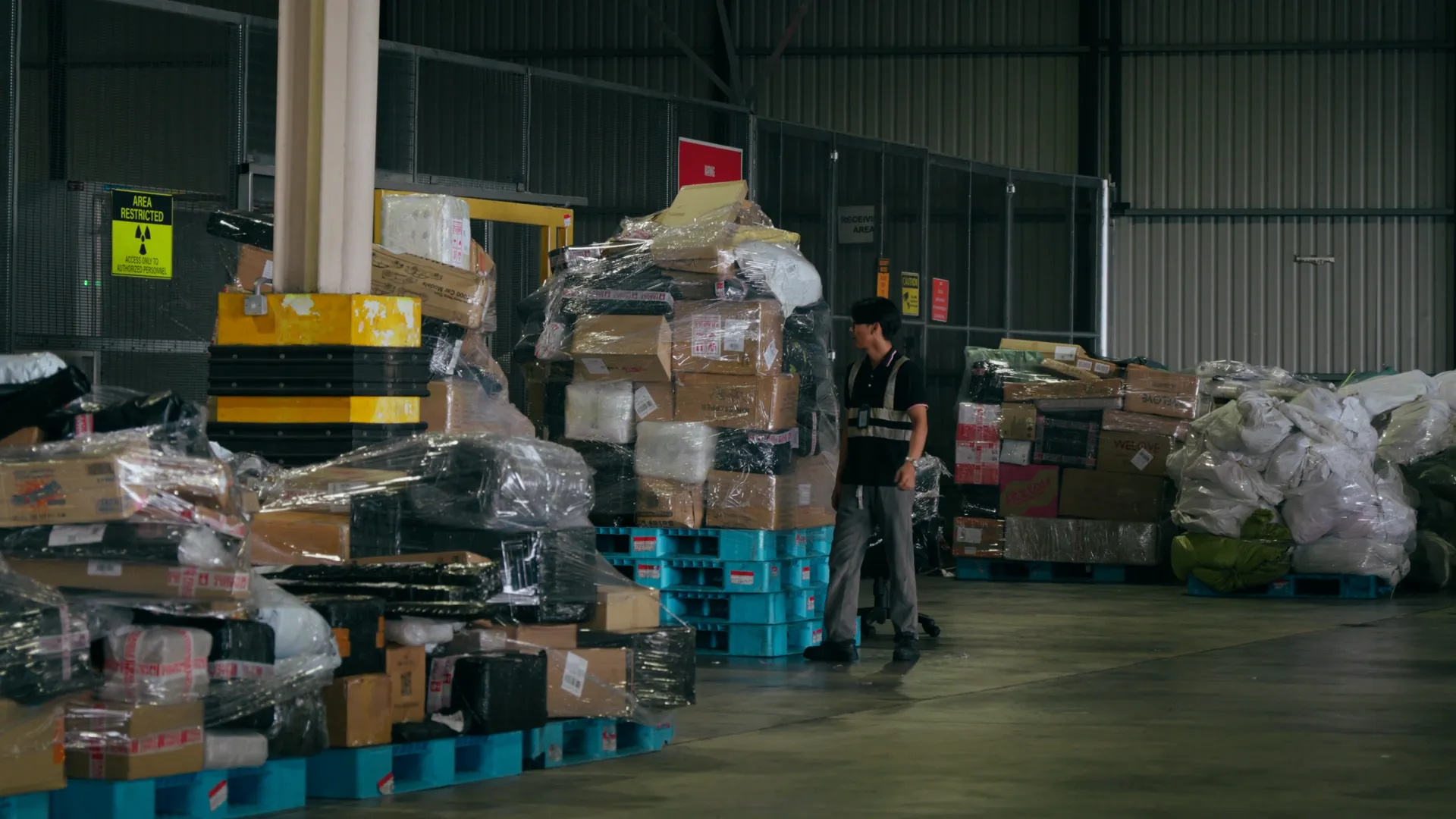 Belli team members with airline cargo handlers in a warehouse
